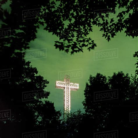 Illuminated Mont Royal Cross at dusk, Montreal, Quebec, Canada - Stock Photo - Dissolve