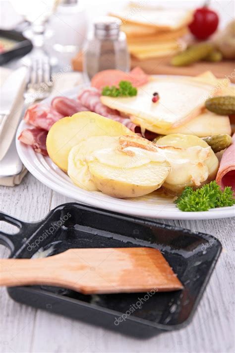 Raclette cheese Stock Photo by ©studioM 57724863