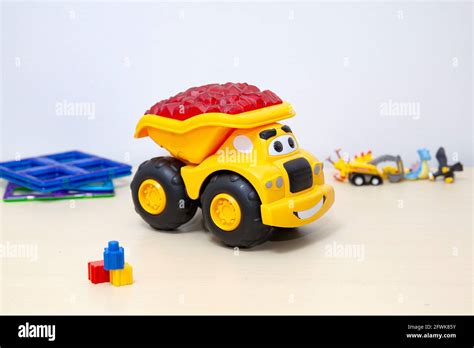 Baby's yellow dump truck toy Stock Photo - Alamy