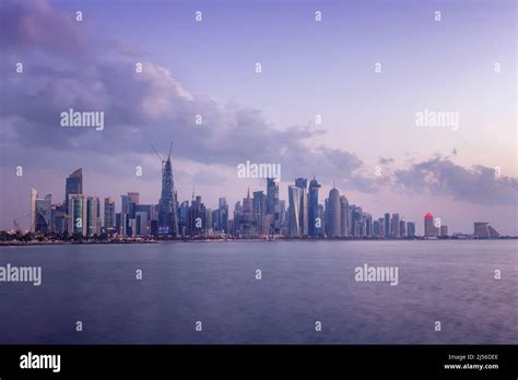 Doha Skyline view early morning. Doha Corniche beach Stock Photo - Alamy