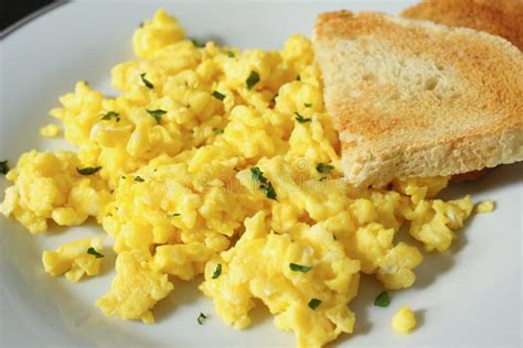 Scrambled eggs with toast stock image. Image of eggs - 50017693