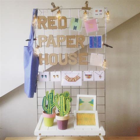 Market Stall Display, using a grid wall to display the Red Paper House name signage and hanging ...