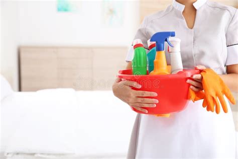 Young Chambermaid with Cleaning Supplies in Hotel Room, Closeup. Stock ...