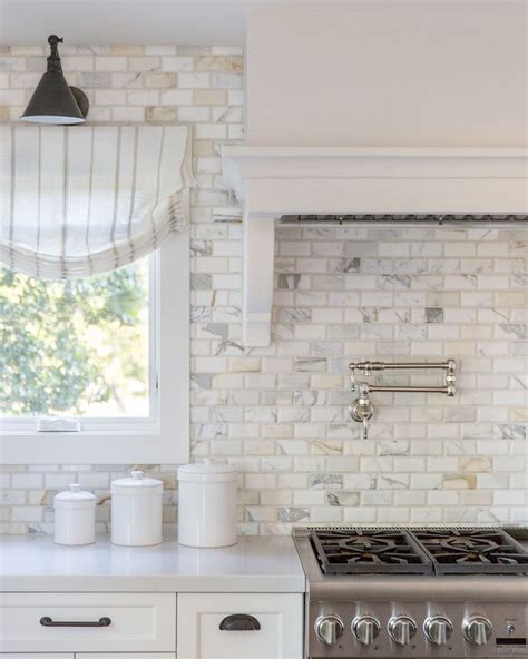 Daydreaming about this incredible marble subway tile in our #MarinHillsideCottage kitchen ...