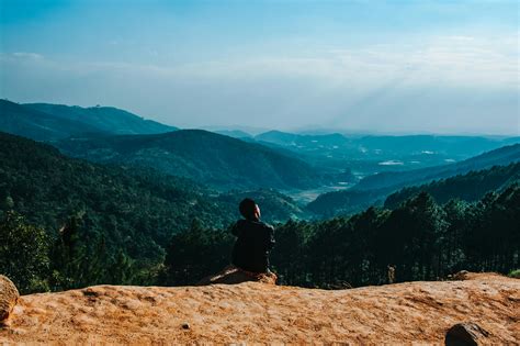 Person Sitting By The Cliff · Free Stock Photo