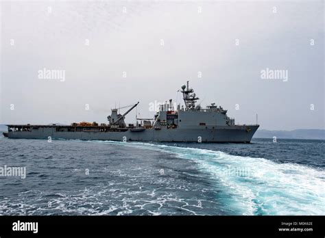 The U.S. Navy Harpers Ferry-class amphibious dock landing ship USS Carter Hall steams underway ...