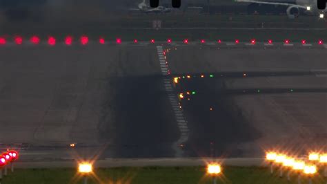 Slow motion - airplane landing at the airport in the evening 28562740 Stock Video at Vecteezy