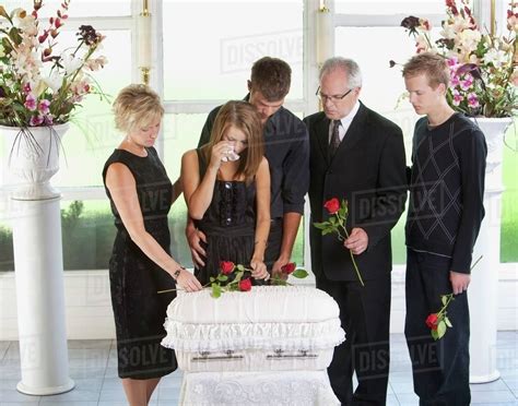 Grieving Family With An Infant's Coffin - Stock Photo - Dissolve