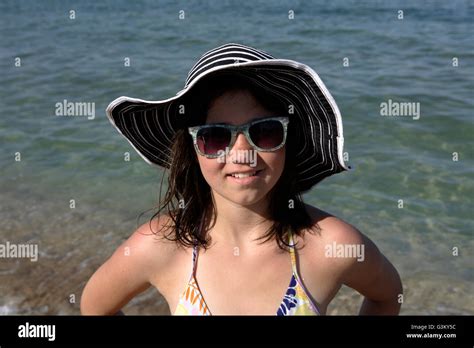 Girl, 12 years, on a beach, portrait Stock Photo - Alamy