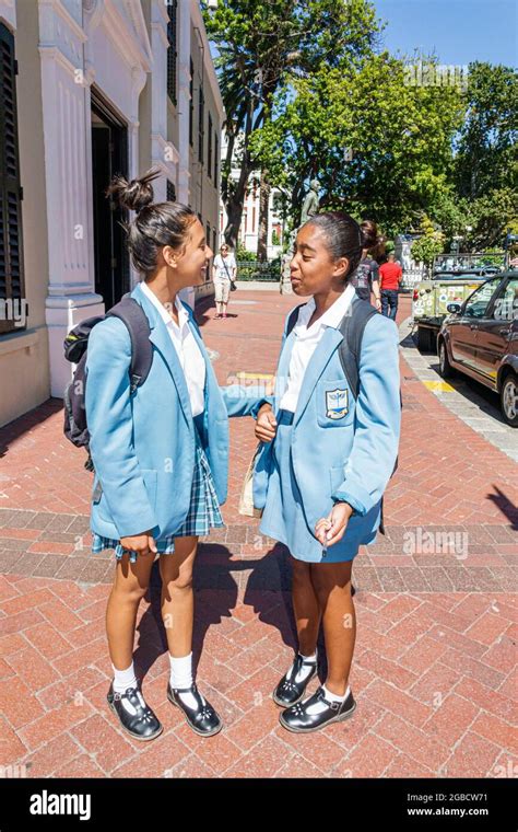 Friends students school uniform teens teenagers gardens commercial high school hi-res stock ...