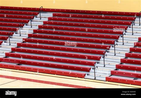 Folding gymnasium bleachers in a modern high school gym Stock Photo - Alamy