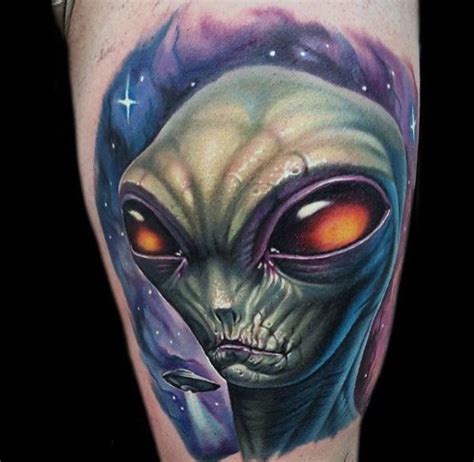 Alien Head Hand Tattoo - In general, the alien tattoo can often hold symbolic value. - Janel Star