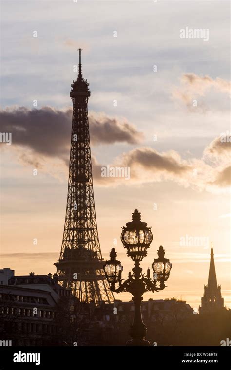 Eiffel Tower with dramatic sunset at Pont Alexandre III Stock Photo - Alamy