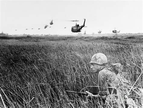 Soldier Crouching In Mekong Delta Photograph by Bettmann - Pixels