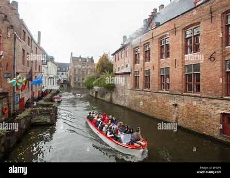 Canal boat tour in Bruges, Belgium Stock Photo - Alamy