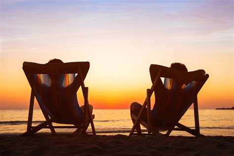 Happy Couple Relaxing In Beach Hotel At Sunset Honeymoon Stock Photo - Download Image Now - iStock