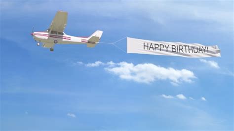 Small Propeller Airplane Towing Banner with HAPPY BIRTHDAY Caption in ...