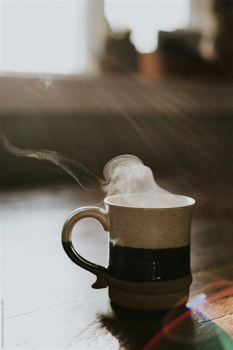 "Steaming Coffee Cup On Table" by Stocksy Contributor "Alicia Magnuson ...