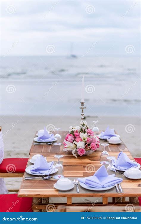 Romantic Dinning Table on the Beach . Table Setting at a Luxury Wedding and Beautiful Flowers on ...