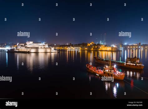 Valletta port at night with anchored ships and Vauban fort, in Malta Stock Photo - Alamy