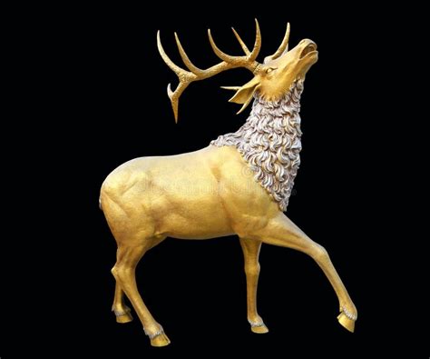 A Golden Deer Statue Isolated on Black Background Stock Photo - Image ...