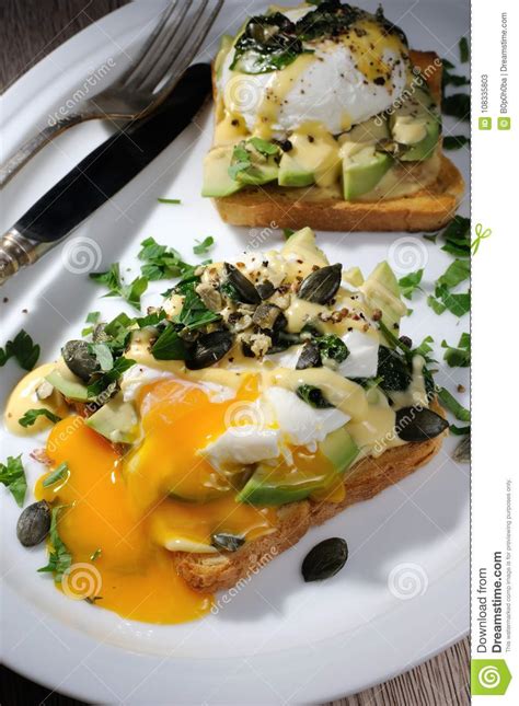 Eggs Benedict with Avocado on Toast Stock Image - Image of eating ...