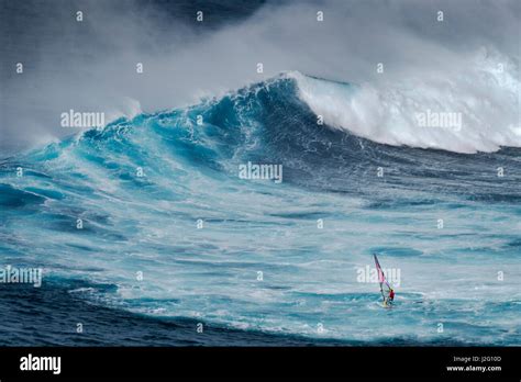 USA, Hawaii, Maui. Robby Naish windsurfing monster waves at Pe'ahi Jaws, North Shore Maui Stock ...