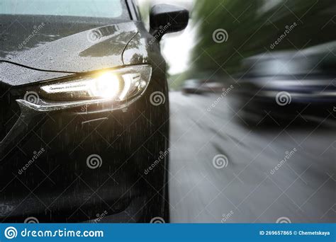 Black Car Driving at High Speed on Rainy Day Outdoors, Closeup with ...