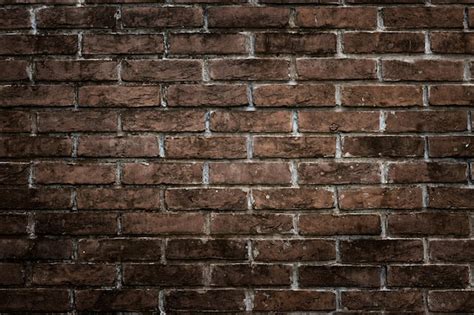 Premium Photo | Dark rustic brick wall for texture and pattern background