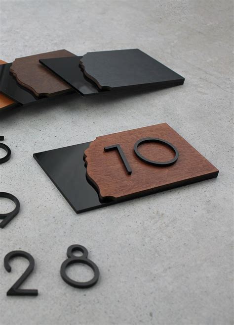 Signs and numbers made of wood in interiors | Door signage, Signage, Signage design