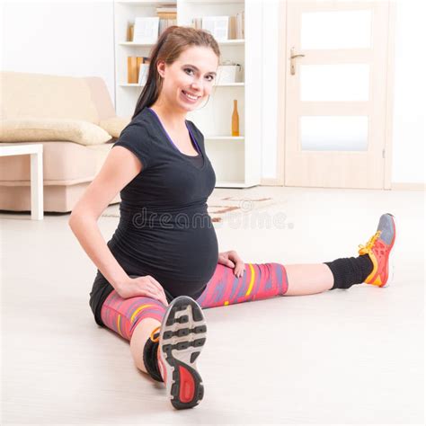 Pregnant Woman Exercising at Home Stock Photo - Image of healthcare, adult: 50895464