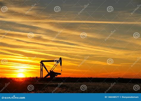 Pumpjack in the Oil Field at Sunset Stock Image - Image of industrial, natural: 146048577