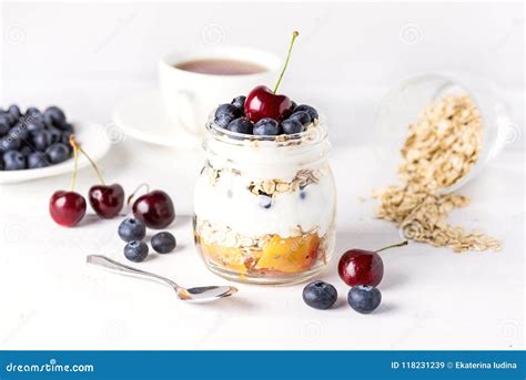 Yogurt with Oatmeal Fruits and Berry Healthy Diet Breakfast Rustic White Wooden Background ...