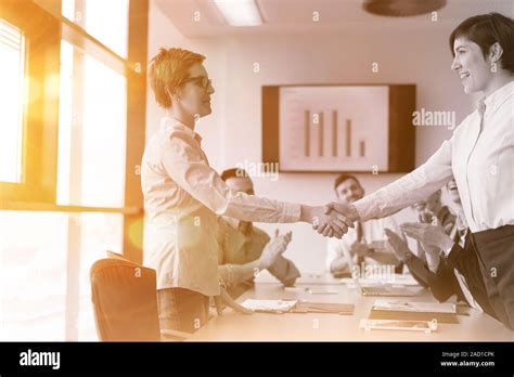 Business womans handshake Stock Photo - Alamy