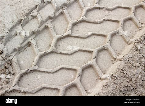 Close-up image showing the texture of tyre marks in the sand Stock Photo - Alamy