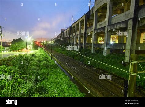 The Joetsu Line runs parallel to the raised tracks of the Joetsu Shinkansen bullet train line on ...