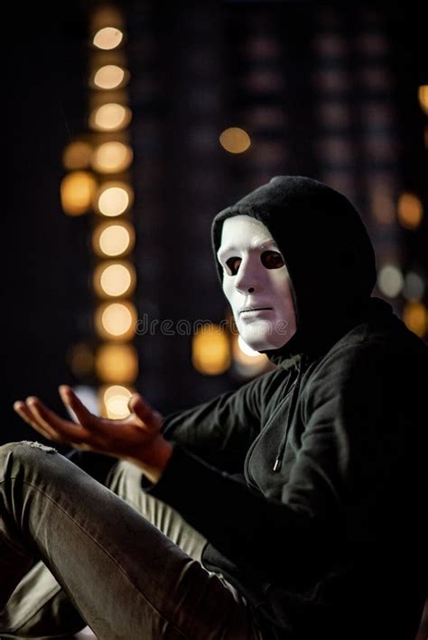 Mystery Man in White Mask Sitting in the Rain Stock Image - Image of lonely, disorder: 136701795