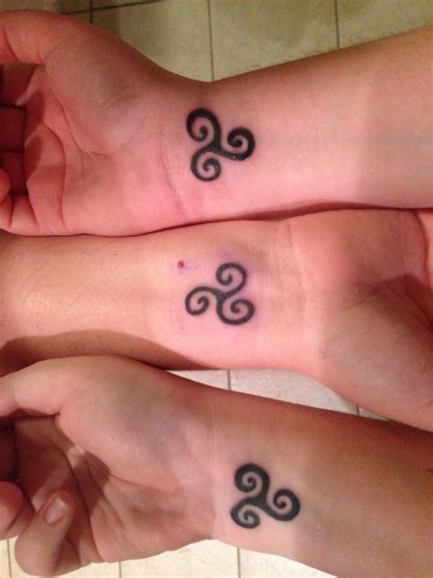 Sisters symbol tattoo