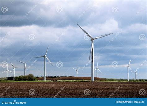 Field with wind turbines stock photo. Image of industry - 262200758