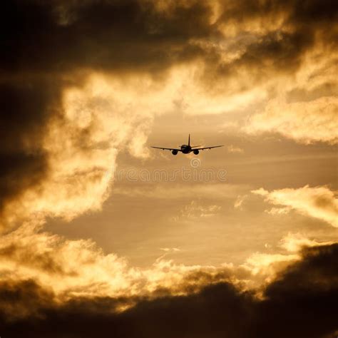 Silhouette of an Airplane Flying at Sunset Clouds. Stock Photo - Image of journey, vacation ...