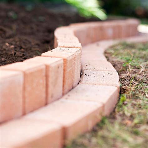 How to Plant A Curved Brick Flowerbed Border | Brick garden edging, Brick garden, Easy landscaping