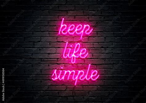 Pink neon sign motivational quote with brick wall background; Keep life ...