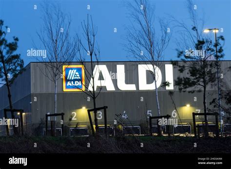 Store logo at night for ALDI supermarket England UK Stock Photo - Alamy