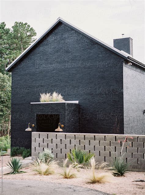 "Exterior Of A Modern Black Brick House" by Stocksy Contributor "Kristen Curette & Daemaine ...