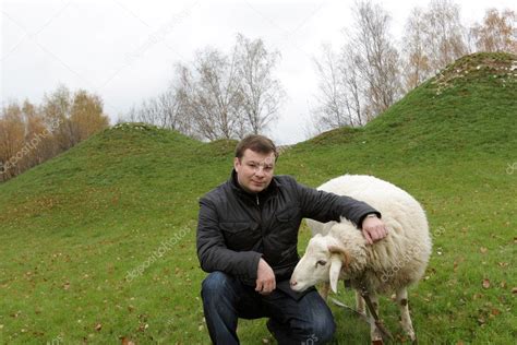 Man and sheep — Stock Photo © AChubykin #1086736