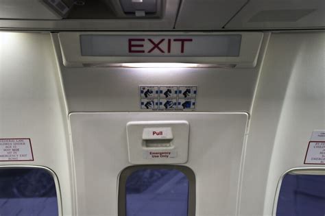 Exit Sign Above an Emergency Exit Door on an Airplane | ClipPix ETC: Educational Photos for ...