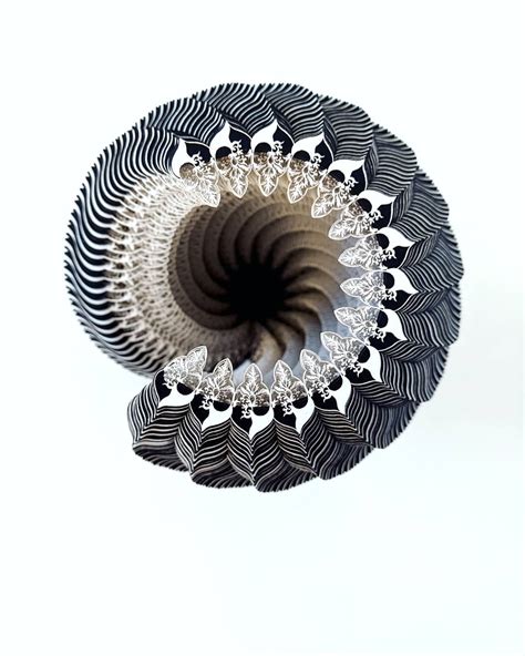 Intricate Designed Laser Cut Paper Sculptures by Julia Ibbini