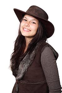 Royalty-Free photo: Brown cowboy hat on black boots | PickPik