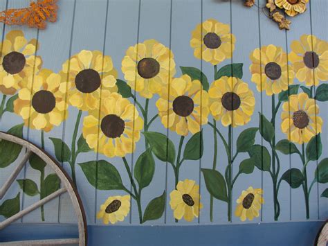 Sunflowers being painted on the side of a home. Forever in a field of Sunflowers. | Garden fence ...