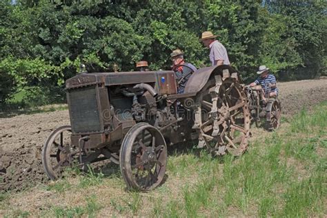 Plowing with old tractor editorial photo. Image of crop - 19725711